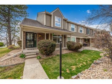 Charming townhome with well-maintained front yard and welcoming covered entryway at 5316 S Jellison St, Littleton, CO 80123