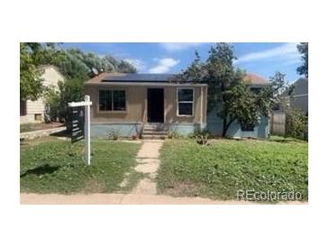 A charming home with lovely lawn and solar panels on the roof at 160 Utica St, Denver, CO 80219