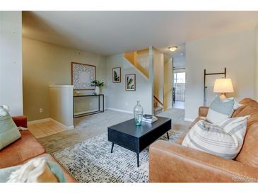 Inviting living room featuring modern décor, neutral tones, and a cozy seating arrangement at 1865 Terry St # 3, Longmont, CO 80501