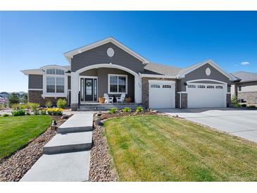 Charming single-Gathering home with landscaped yard and a three car garage at 32 Latigo Pl, Littleton, CO 80123