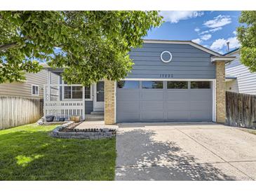 Charming single-Gathering home with a two-car garage and manicured lawn at 17692 E Brown Cir, Aurora, CO 80013