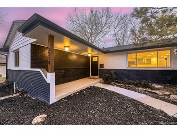 Charming single-Gathering home featuring a brick facade and a well-manicured front yard at 3318 S Dayton Ct, Denver, CO 80231
