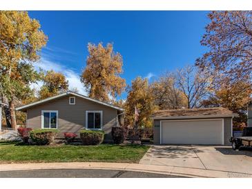 Charming single-story home featuring well-maintained landscaping and a detached two-car garage at 9310 Pierce St, Broomfield, CO 80021