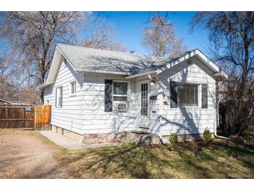 Charming single-story home featuring a well-maintained front yard and white siding at 2345 S Williams St, Denver, CO 80210