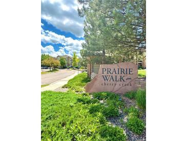 Prairie Walk on Cherry Creek community entrance with landscaping and signage at 17346 Nature Walk Trail # 105, Parker, CO 80134