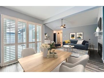 Open dining room, seamlessly connected to living room with great light and comfortable seating at 2504 S Victor St # E, Aurora, CO 80014