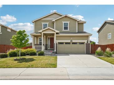 Charming two-story home with a well-manicured lawn, attached garage, and inviting curb appeal at 2682 E 161St Pl, Thornton, CO 80602