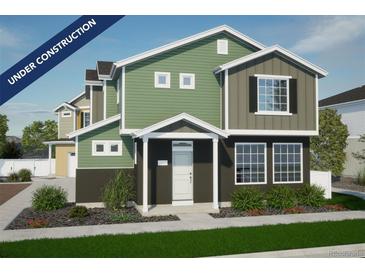 Two-story green and brown house with a two-car garage at 22022 E 38Th Pl, Aurora, CO 80019
