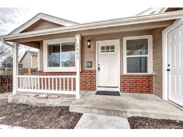 Updated craftsman style home with a welcoming front porch at 1980 W 132Nd Ave, Denver, CO 80234