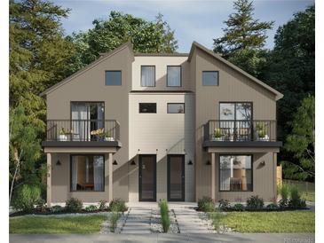 Modern two-story exterior with balconies, neutral colors, and landscaped front yard at 2417 S Lafayette St, Denver, CO 80210