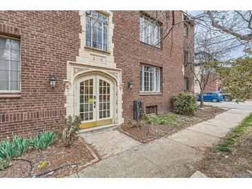 Charming brick building entrance featuring a decorative archway and elegant glass doors at 2115 E 14Th Ave # 8, Denver, CO 80206