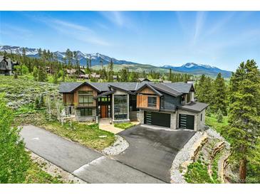 Stunning modern home with mountain views, professional landscaping and driveway at 444 Glen Eagle Loop, Breckenridge, CO 80424
