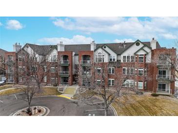 Attractive brick multi-Gathering exterior with balconies and well-maintained landscaping at 2897 W Riverwalk Cir # 204, Littleton, CO 80123