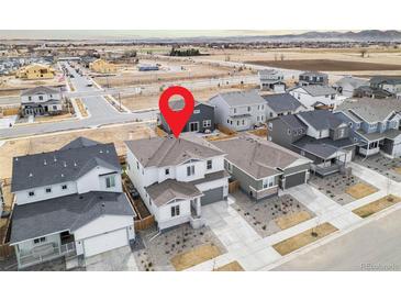 Aerial view of home in a neighborhood with well-maintained lawns, mature trees, and convenient access to local amenities at 1408 Brookfield Pl, Lafayette, CO 80026