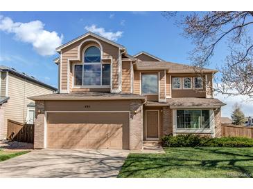 Inviting two-story home with a two-car garage and well-manicured lawn at 495 Bexley St, Highlands Ranch, CO 80126