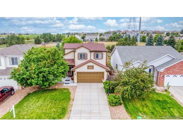 Charming two-story home with a well-maintained lawn and a two-car garage at 22160 Wintergreen Way, Parker, CO 80138
