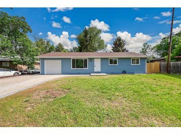 Charming blue single-story home with a well-manicured lawn and a one car garage, bathed in sunlight at 1552 W Caley Ave, Littleton, CO 80120