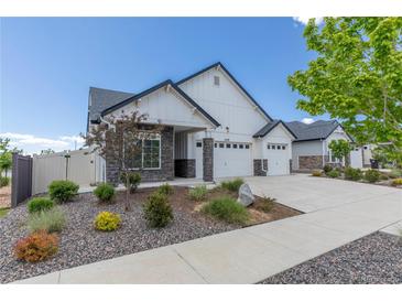 Charming single-Gathering home with manicured landscaping and a three-car garage for ample parking and storage at 21701 E 50Th Dr, Aurora, CO 80019