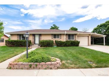 Charming ranch home featuring a well-manicured lawn and inviting curb appeal at 6666 S Pennsylvania St, Centennial, CO 80121