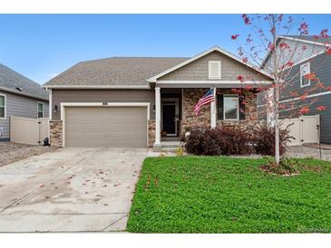 Charming single-Gathering home featuring a well-manicured lawn and an attached two-car garage at 7227 Clarke Dr, Frederick, CO 80530