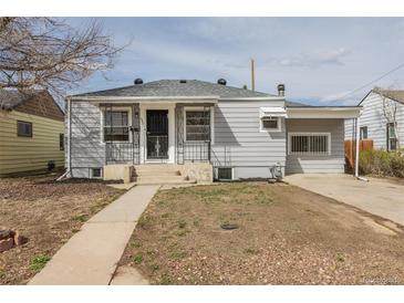 Charming gray single-story home with a well-maintained front yard and inviting entryway at 1945 Nome St, Aurora, CO 80010
