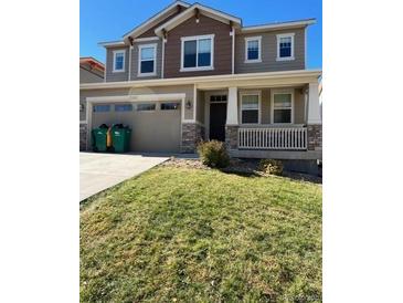 Two-story house with attached garage and landscaped yard at 21383 E Smoky Hill Rd, Centennial, CO 80015