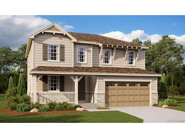 Charming two-story home featuring a two-car garage, welcoming front porch, and tasteful siding at 24910 E 42Nd Ave, Aurora, CO 80019