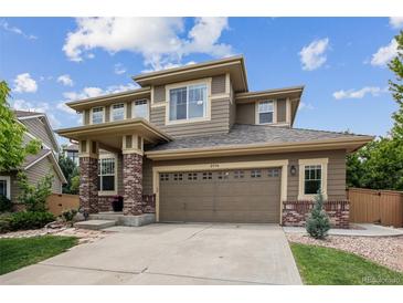 Charming two-story home with a two car garage and neutral colored siding at 2934 Braeburn Way, Highlands Ranch, CO 80126