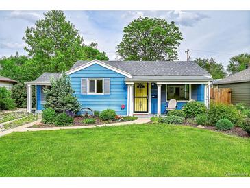 Charming blue bungalow featuring a well-manicured lawn and inviting front porch at 1720 Trenton St, Denver, CO 80220