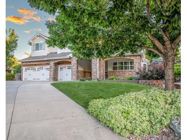 Charming two-story home with three-car garage and meticulously landscaped front yard at 6588 S Sheridan Loop, Littleton, CO 80123