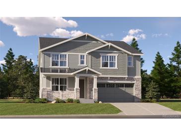 Charming two-story home featuring stone accents, a covered porch, and an attached two-car garage at 2162 S Gold Bug Way, Aurora, CO 80018