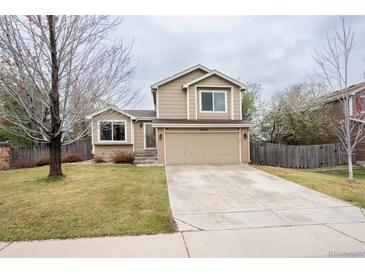 Charming two-story home featuring a well-maintained lawn and an attached two-car garage at 4820 W 125Th Ave, Broomfield, CO 80020