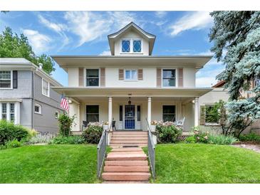Charming two-story home featuring a covered porch, mature landscaping, and a welcoming entrance at 4045 E 18Th Ave, Denver, CO 80220