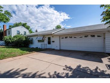 Charming single-story home with a well-maintained front yard and attached two-car garage at 505 Maple St, Golden, CO 80403