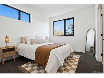 Bright bedroom with natural light, neutral color scheme and stylish decor at 1601 Park Ave # 216, Denver, CO 80218