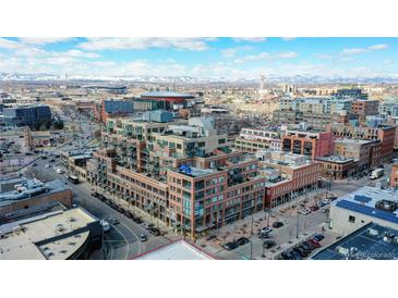 Aerial view of a city building showing its multiple floors and surrounding cityscape at 1499 Blake St # 5D, Denver, CO 80202