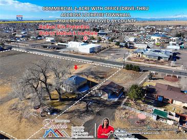 Aerial view of a commercial property with office/drive-thru near Lochbuie Town Hall and Hudson Fire Protection at 724 County Road 37, Brighton, CO 80603