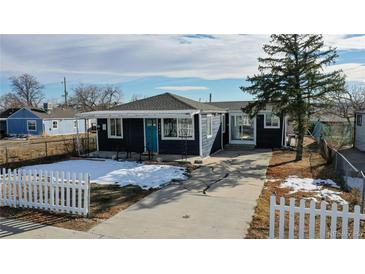 Cute bungalow with new paint, landscaping, and white picket fence at 3282 W 66Th Ave, Denver, CO 80221