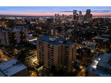 Stunning aerial view of a downtown building with a city skyline at twilight with many building and city lights at 800 N Pearl St # 1203, Denver, CO 80203