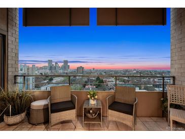 Relaxing balcony with city views, features cozy seating, and ample space for enjoying the outdoors at 800 N Pearl St # 1203, Denver, CO 80203