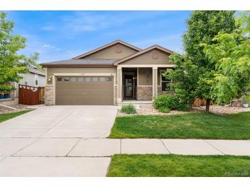 Charming single-Gathering home featuring a two-car garage and a well-manicured lawn, blending comfort and curb appeal at 15061 W 70Th Ave, Arvada, CO 80007