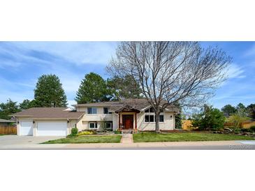 Beautiful two-story home with a well-manicured lawn and attached two car garage at 5925 E Fair Ave, Centennial, CO 80111