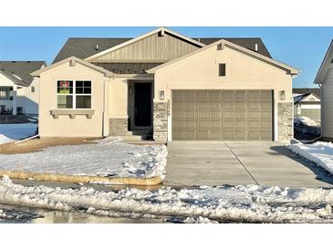 Charming single-story home featuring a two-car garage and neutral exterior at 17569 Cerberus Ct, Monument, CO 80132