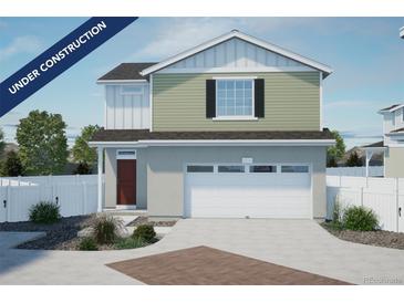 Two-story home with a white garage door and siding, with sage green horizontal siding on the second story at 22073 E 38Th Pl, Aurora, CO 80019