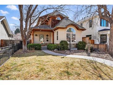 Charming exterior view of the home with a well-maintained lawn and inviting walkway at 2424 S Steele St, Denver, CO 80210