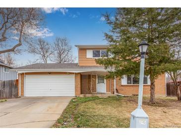 Charming two-story home with a two car garage and mature trees at 1410 S Grant St, Longmont, CO 80501