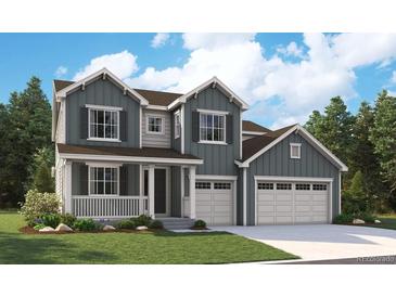 Charming two-story home with a welcoming front porch and an attached three-car garage at 5617 Riverbend Ave, Firestone, CO 80504