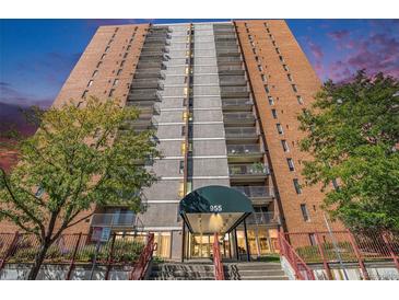 Striking high-rise with brick facade, concrete accents, and multiple balconies at 955 Eudora Street St # 108E, Denver, CO 80220