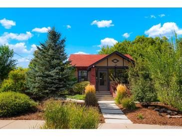 Charming craftsman home with a red roof and landscaped front yard at 4425 King St, Denver, CO 80211