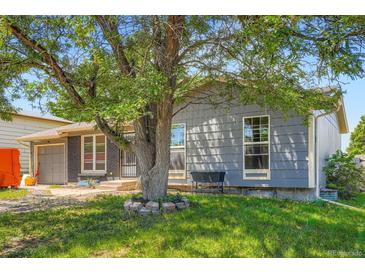 Charming home featuring mature landscaping and a well-maintained front yard, creating curb appeal at 2615 S Laredo Ct, Aurora, CO 80013